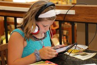 girl using ipad at the Sibley Public Library