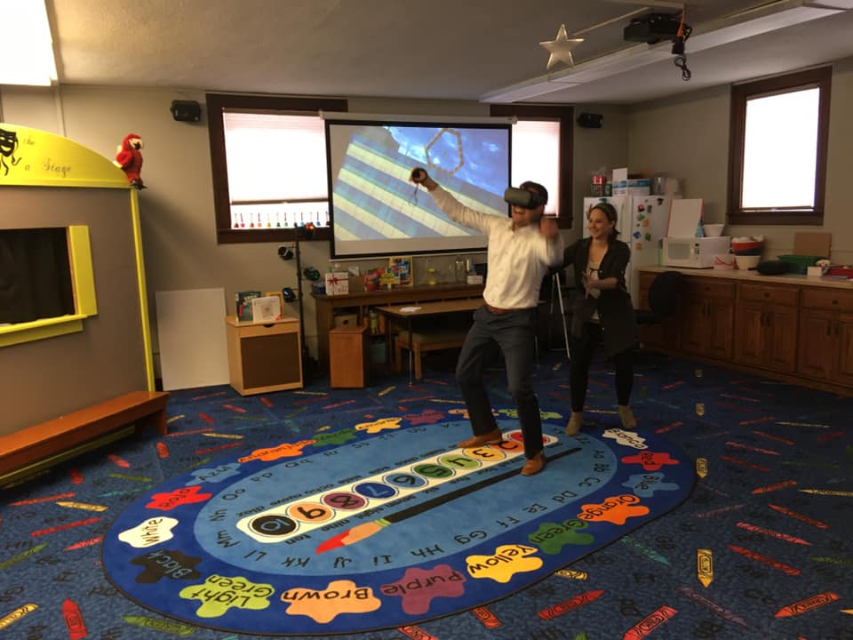 gentleman using virtual reality device at the library