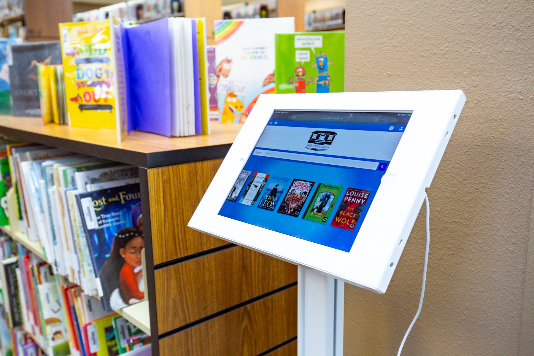 image of ipad in library used to search for available titles