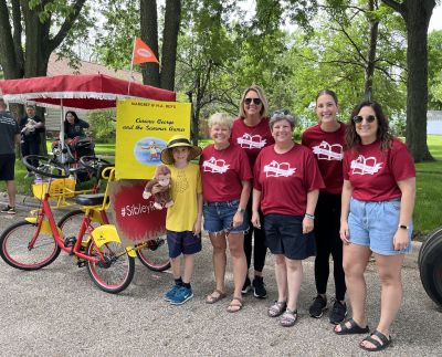 #SibleyReads committee in parade with Curious George theme